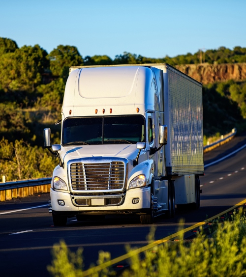 dry van box truck service securing construction materials on a pallet for transport